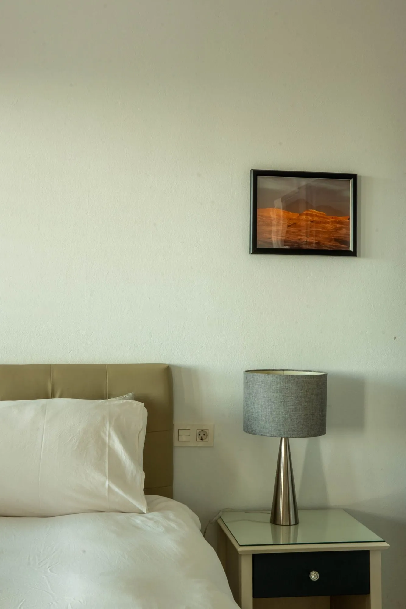 A bedside table in one of the bedrooms
