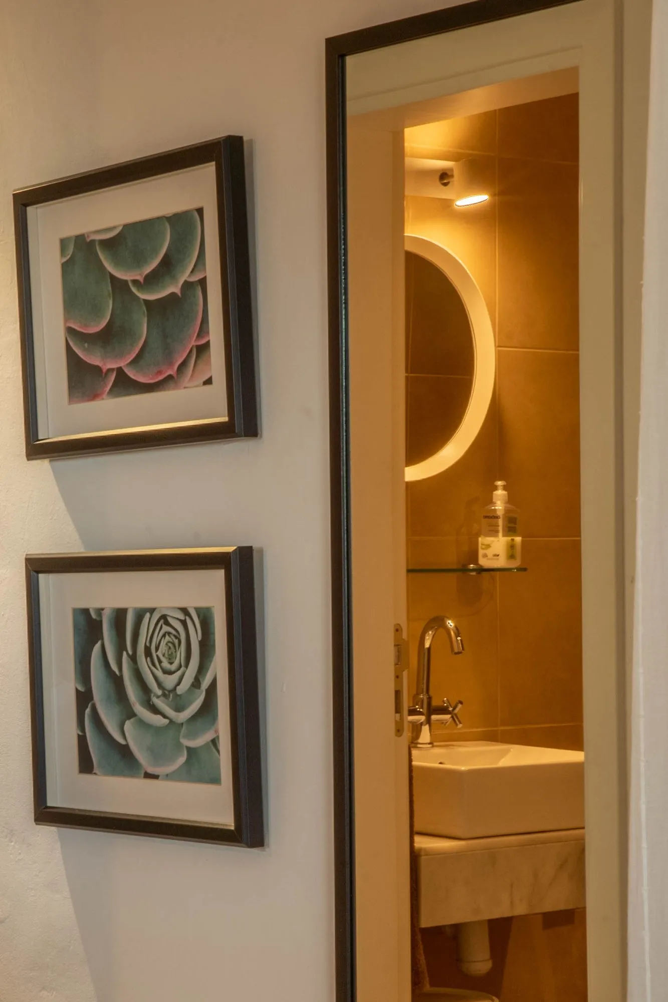 An ensuite shower room, through its open door