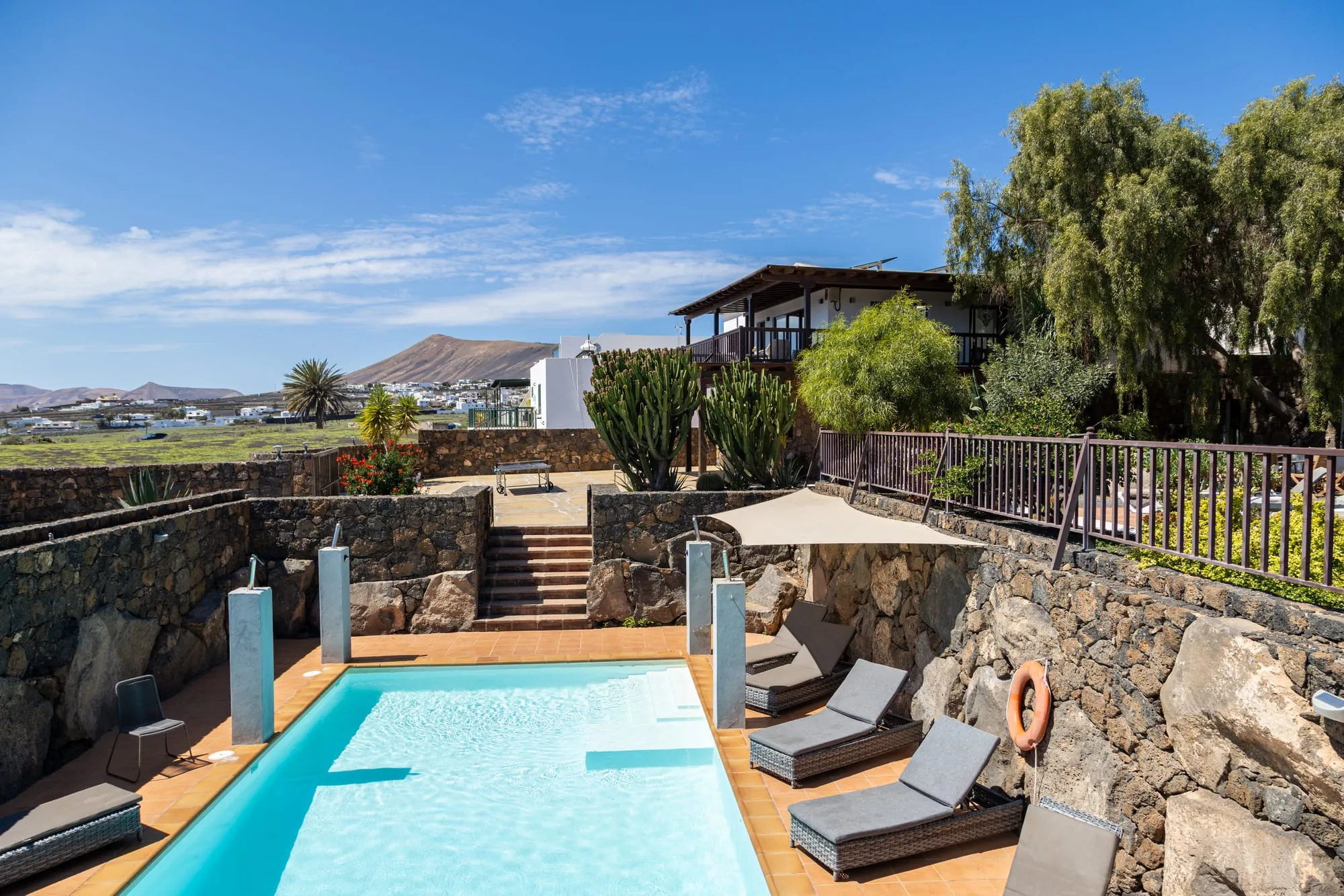The sunken heated pool, with the house on the terrace above it