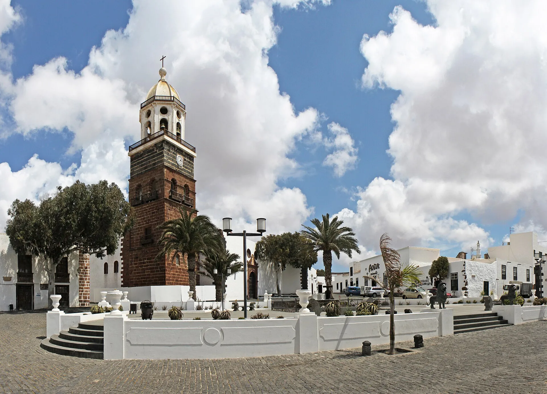 The tower of the church of Nuestra Señora de Guadalupe over the whitewashed square in Teguise